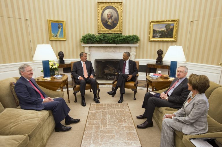 President Barack Obama meets with Congressional leaders in the Oval Office of the White House in Washington, Tuesday, Sept. 9, 2014, in Washington, to discuss options for combating the Islamic State. From left are, Senate Minority Leader Mitch McConnell of Ky., House Speaker John Boehner of Ohio, the president, Senate Majority Leader Harry Reid of Nev., and House Minority Leader Nancy Pelosi of Calif. (AP Photo/Evan Vucci)