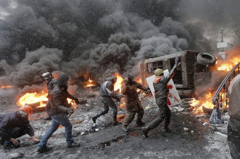 FILE - In this Wednesday, Jan. 22, 2014 file photo protesters clash with police in central Kiev, Ukraine. (AP Photo/Efrem Lukatsky, file)