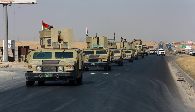 Kurdish security forces head to a town on the outskirts of Irbil, Iraq. (AP Photo/Khalid Mohammed)