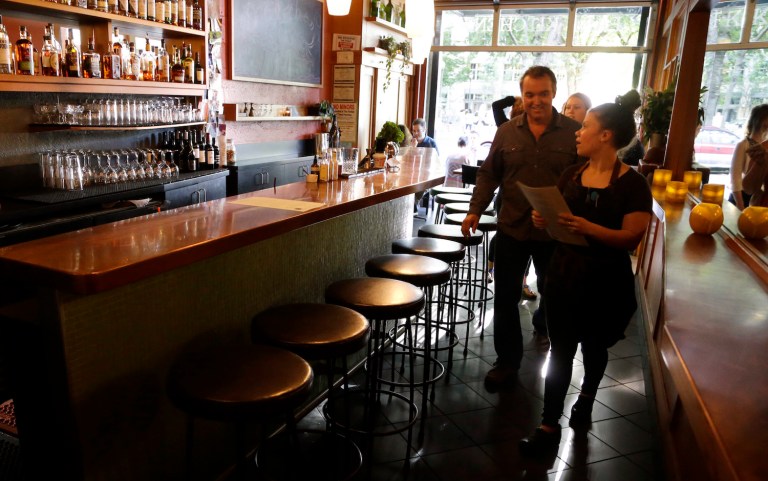 Success of movement has brought more attention to the laws' exception for tipped employees. (AP Photo/Don Ryan)