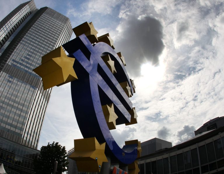 FILE - In this July 31, 2012 file photo the euro sculpture stands in front of the headquarters of the European Central Bank, ECB, in Frankfurt, Germany. The crisis in Ukraine and a hesitant recovery in Europe are casting shadows over the European Central Bank's meeting Thursday, Aug. 7, 2014. Economists say the monetary authority for the 18 countries that use the euro will look to reassure markets that it is ready to add more stimulus measures if the economy takes a serious turn for the worse. (AP Photo/Michael Probst, File)