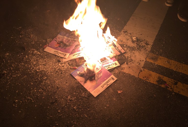 Copies of the Washington Examiner magazine were burned outside an alt-right party in Washington, D.C., on Jan. 19. (Photo courtesy: Griff Jenkins/Fox News)