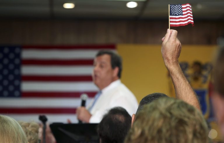 A Christie supporter wanted to use flags from the World Trade Center in his campaign. (AP Photo/Mel Evans)