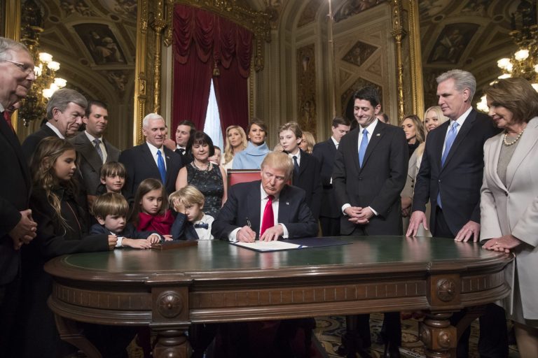 President Donald Trump is joined by the Congressional leadership and his family as he formally signs his cabinet nominations into law, Friday, Jan. 20, 2107 (AP Photo/J. Scott Applewhite, Pool)