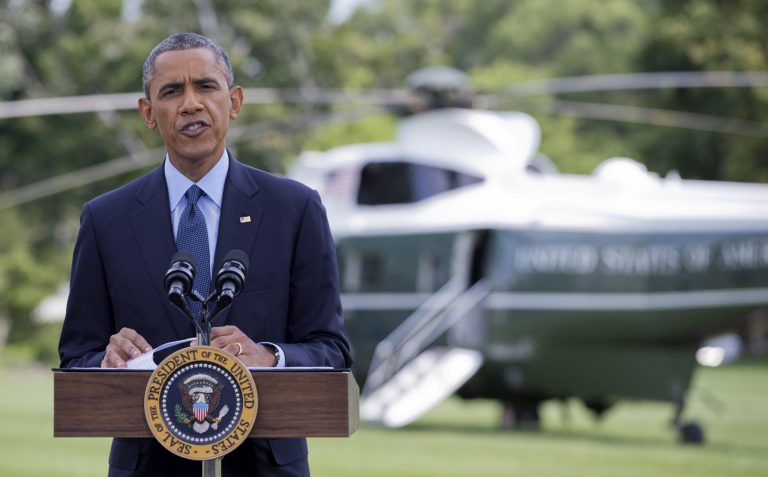 President Barack Obama speaks on the South Lawn of the White House in Washington, Tuesday, July 29, 2014, as he announces new economic sanctions against key sectors of the Russian economy in the latest move to force Russian President Vladimir Putin to end his support for Ukrainian rebels.   (AP Photo/Manuel Balce Ceneta)
