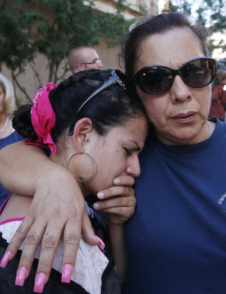 Virginia Aguiar, right, comforts Tiffany Sarmient as she cries in frustration after it was announced the jury deadlocked on the penalty phase of the Jodi Arias murder trial out in front of Maricopa County Superior Court Thursday, May 23, 2013, in Phoenix. Jurors who spent five months determining Jodi Arias' fate couldn't decide whether she should get life in prison or die for murdering her boyfriend, Travis Alexander, in his suburban Phoenix home, so a scheduled July 18 retrial was announced by the judge. (AP Photo/Ross D. Franklin)