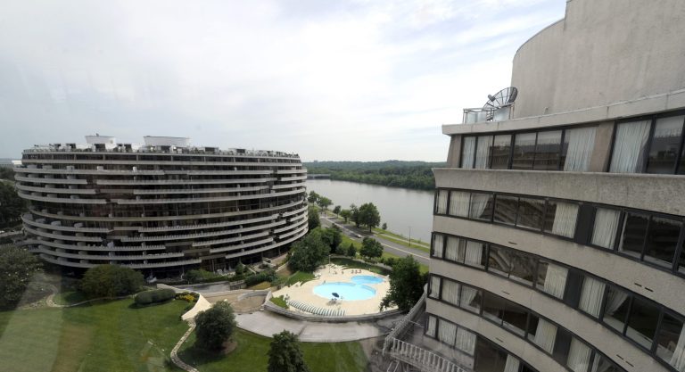   This photo taken May 30, 2012 shows a view of the Watergate complex from the top floor of the Watergate Office Building in Washington Forty years ago police in Washington arrested five men breaking in to the Democratic National Committee offices in Washington. The name of the complex they were breaking into became infamous: the Watergate. These days, though, unless you know where to look, thereâs little marking the location of the 1972 crime that ultimately led to the resignation of President Richard Nixon. The office building that was the site of the break in is still in use, though the tenants have changed. The adjacent hotel where the burglars stayed is currently closed. And another hotel across the street where a lookout waited with a walkie-talkie, monitoring the burglarsâ progress, has been turned into a college dorm. (AP Photo/Susan Walsh)  