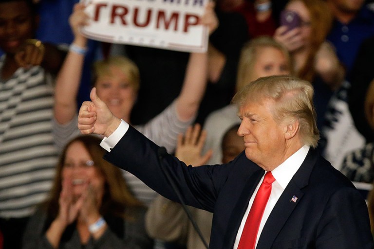 Republican presidential candidate Donald Trump reacts to the crowd of supporters during a campaign rally Monday. (AP Photo/Seth Perlman)