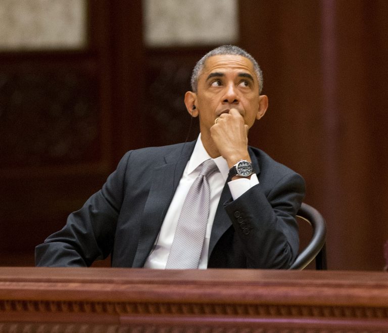U.S. President Barack Obama looks upwards at the the Asia-Pacific Economic Cooperation (APEC) Summit plenary session at the International Convention Center, Yanqi, Tuesday, Nov. 11, 2014 in Beijing. (AP Photo/Pablo Martinez Monsivais, Pool)