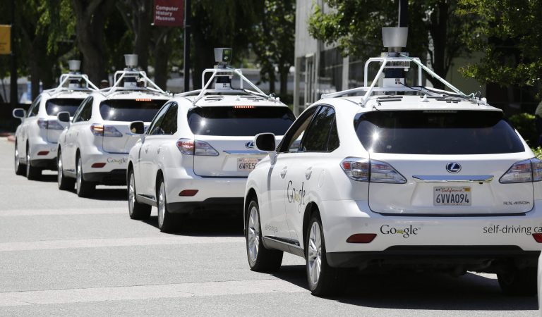 In this May 14, 2014 file photo, a row of Google self-driving cars are shown outside the Computer History Museum in Mountain View, Calif. For the first time, California's Department of Motor Vehicles knows how many self-driving cars are traveling on the state's public roads. The agency is issuing permits, Tuesday, Sept. 16, 2014 that let three companies test 29 vehicles on highways and in neighborhoods. (AP Photo/Eric Risberg, File)