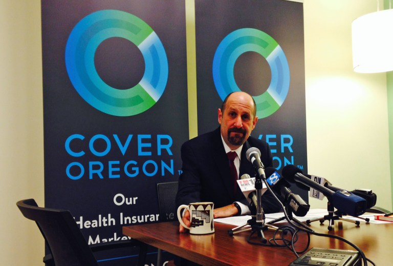 Dr. Bruce Goldberg, acting head of Oregon's troubled health insurance exchange, prepares for a news conference on Tuesday, Dec. 10, 2013, at Cover Oregon's headquarters in Durham, Ore. Goldberg told reporters that thousands of Oregonians who sent in their applications by the deadline may have to go elsewhere for temporary coverage in January. (AP Photo/Gosia Wozniacka)