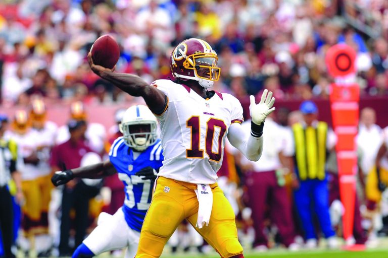 Richard Lipski/AP
Redskins quarterback Robert Griffin III will start against the Saints on Sunday.