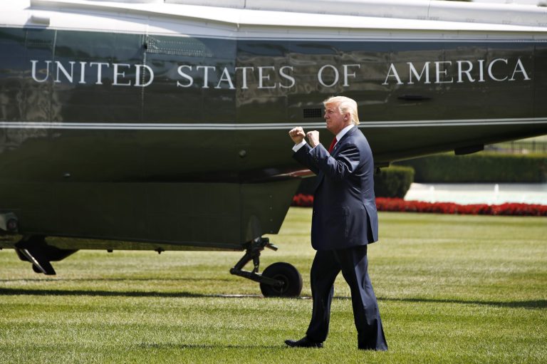 President Donald Trump reacts on seeing visitors to the White House as he walks on the South Lawn of the White House in Washington, Friday, Aug. 4, 2017, to board Marine One helicopter for a short trip to Andrews Air Force Base, Md. en route to Bedminster, N.J., for vacation. (AP Photo/Jacquelyn Martin)