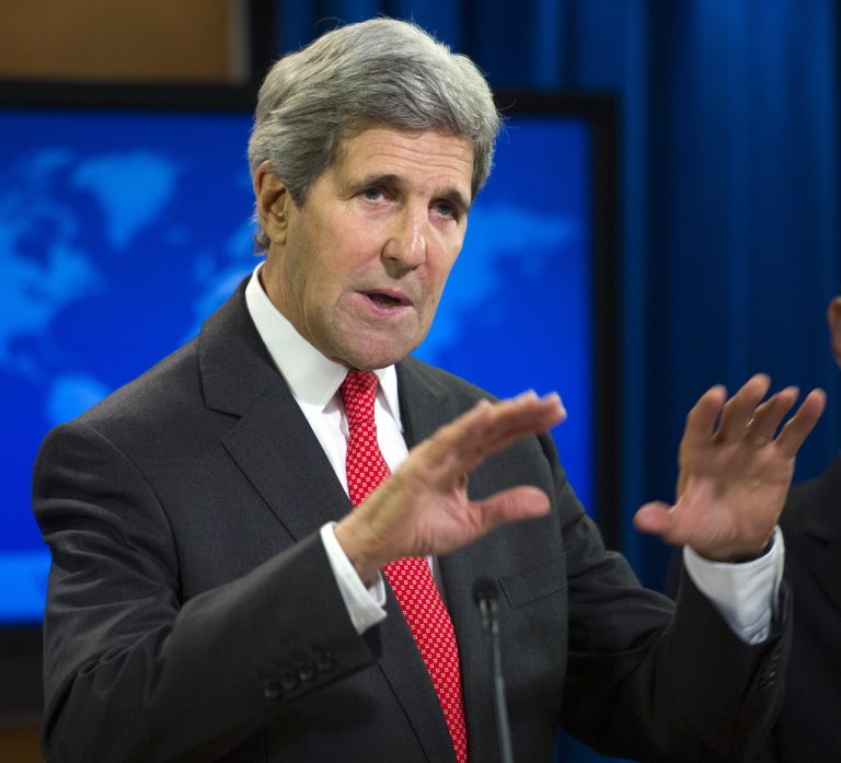 Secretary of State John Kerry speaks at the State Department in Washington, Monday, July 28, 2014, during a news conference to announce the 2013 Annual Report on International Religious Freedom. The U.S. says millions of people were forced from their homes because of their religious beliefs last year. (AP Photo/Cliff Owen)