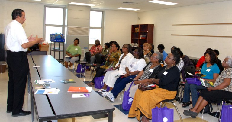 Wallace Cunningham, left, AARP South Carolina Associate State Director for Multicultural Outreach, presents a workshop on the Affordable Health Care Act in Bishopville, S.C., last week. (AP/AARP)