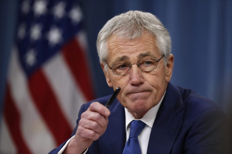 In this Dec. 19, 2013, photo, Defense Secretary Chuck Hagel takes questions as he briefs reporters at the Pentagon in Washington. Veterans groups are fighting part of the new budget deal signed into law Dec. 20 that curbs annual pension increases for military retirees under age 62. After a barrage of protests from the military community, lawmakers said they'll review the cut next year and possibly reverse it.(AP Photo/Charles Dharapak)