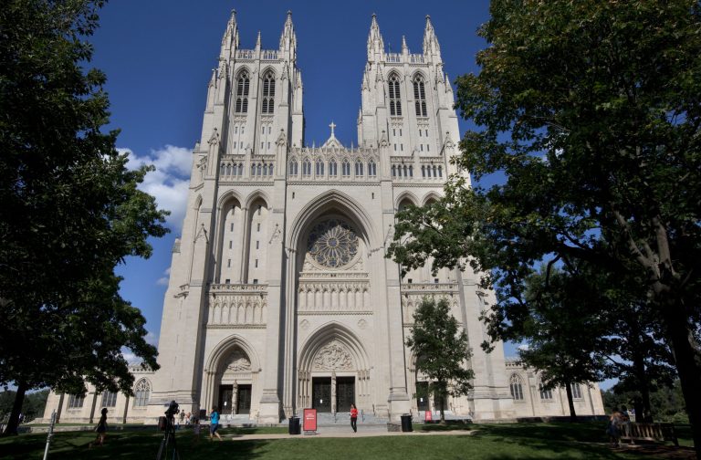 This photo taken July 29, 2013, shows The National Cathedral in Washington. Struggling to cover its costs, Washington National Cathedral has decided to begin charging an admission fee for tourists who visit the church beginning in 2014. Cathedral officials say they will charge a $10 fee for adults and $6 for children, seniors and military. Admission will be free on Sundays and for those who visit to worship or pray on weekdays. (AP Photo/Jacquelyn Martin)