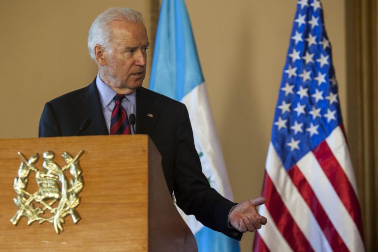 Vice President Joe Biden turns to Guatemala's President Otto Perez Molina during a news conference at the National Palace in Guatemala City, Friday, June 20, 2014. (AP Photo/Luis Soto)