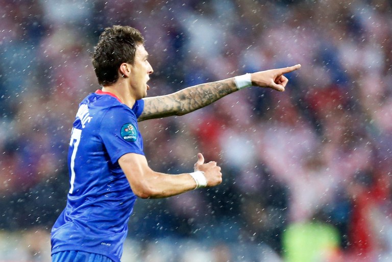   Croatia's Mario Mandzukic celebrates after he scored during the Euro 2012 soccer championship Group C match between the Republic of Ireland and Croatia in Poznan, Poland, Sunday, June 10, 2012. (AP Photo/Jon Super)  