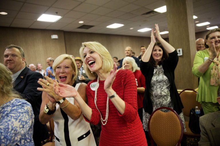Amy Peil, left, and Ginger Howard cheer as Republican candidate for Georgia's 6th District seat Karen Handel speaks at an election night watch party in Roswell, Ga., Tuesday, April 18, 2017. (AP Photo/David Goldman)