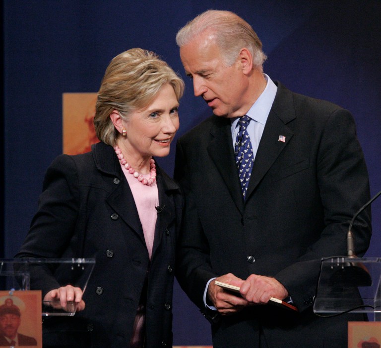 In this Thursday, June 28, 2007, file photo, Democratic Presidential hopeful Sen. Hillary Rodham Clinton, D-N.Y., left, listens to Sen. Joseph Biden, D-Del., during the televised Democratic presidential candidates debate at Howard University in Washington. (AP Photo/Pablo Martinez Monsivais, File)