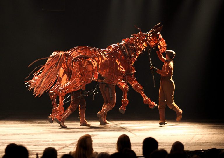 The horse Joey trots across the stage during his curtain call for the opening night performance of 
