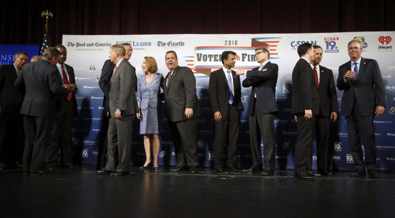 Participants speak among themselves after the forum Monday, Aug. 3, 2015, in Manchester, N.H. (AP Photo/Jim Cole)