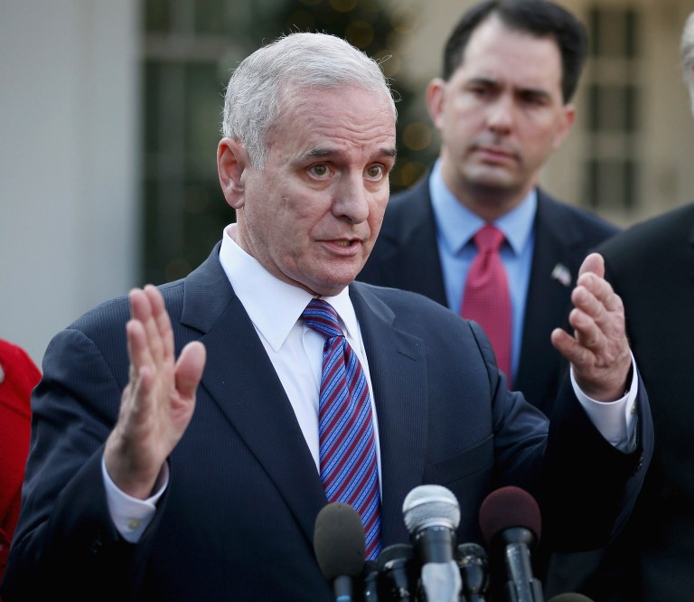 In 2011, Gov. Mark Dayton (left) issued an executive order, which aside from the ability to unionize, didn't offer home health providers any state employee benefits. (Getty images/Chip Somodevilla)