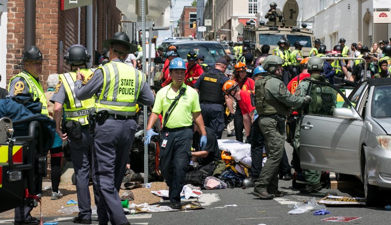 Rescue workers and medics tend to dozens of injured people when a car plowed through a crowd of anti-facist counter-demonstrators marching through the downtown shopping district in Charlottesville, Va. (Graeme Jennings/Washington Examiner)