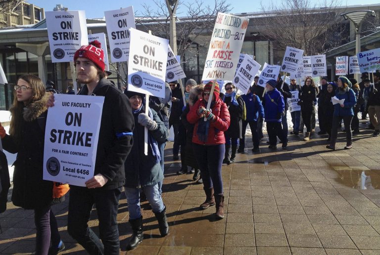 University of Illinois at Chicago faculty members hold a kick-off rally before a two-day strike to protest low wages as contract negotiations continue Tuesday.  (AP/Sun-Times Media, Stefano Esposito) 