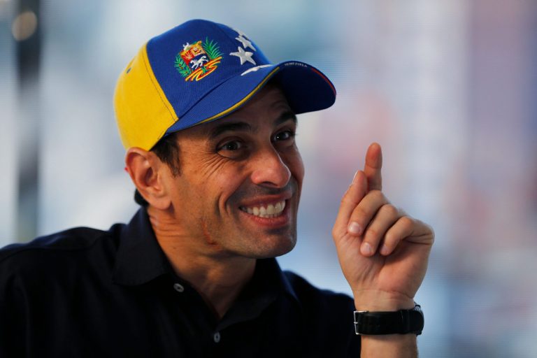 In this Feb. 25, 2014 photo, Opposition leader and Mirada's State governor Henrique Capriles gestures during an interview at his office in Caracas, Venezuela. Capriles says the opposition has put its differences over strategy behind them, adding that the government may have miscalculated its response to the protests as well. (AP Photo/Fernando Llano)