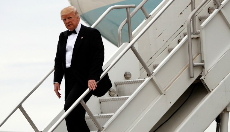 President Trump steps off Air Force One after arriving at JFK Airport in New York. Trump said he's working from his club in New Jersey this weekend in order to avoid a major disruption in New York City. (AP Photo/Pablo Martinez Monsivais)