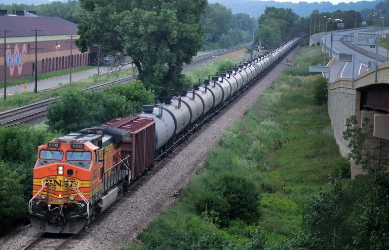 In this July 25, 2014 photo, an oil train moves through the area South of St Paul, Minn.  Railroad documents released by the state Department of Public Safety show about 50 trains carrying crude oil from North Dakota are passing through Minnesota each week. The documents obtained by The Associated Press were first reported Saturday, July 26 by the Star Tribune. (AP Photo/The Star Tribune, Connor Lake)  MANDATORY CREDIT; ST. PAUL PIONEER PRESS OUT; MAGS OUT; TWIN CITIES LOCAL TELEVISION OUT