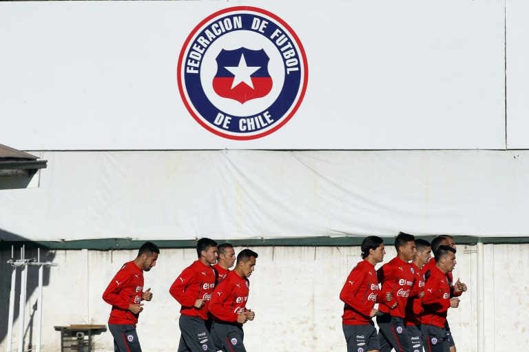 Chile's soccer players warm up for a training session in Santiago, Chile, Wednesday, May 28, 2014. Chile will play a friendly match with Egypt in Santiago on Friday prior to competing at the World Cup in Brazil in June.  (AP Photo/Luis Hidalgo)
