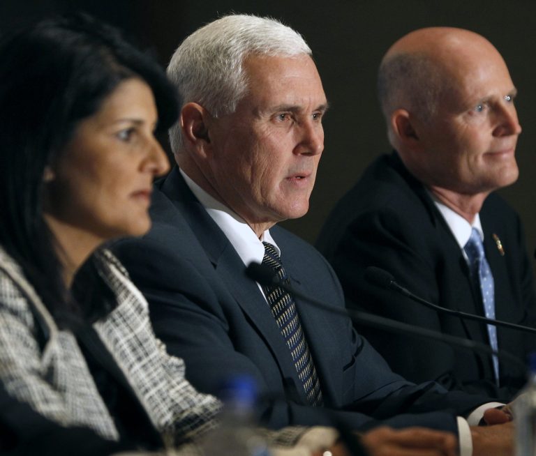 Indiana Gov. Mike Pence, center, speaks during a news briefing for the Republican Governors Association 2013 annual conference with South Carolina Gov. Nikki Haley, left, and Florida Gov. Rick Scott, right, on Thursday in Scottsdale, Ariz. (AP Photo/Ralph Freso)