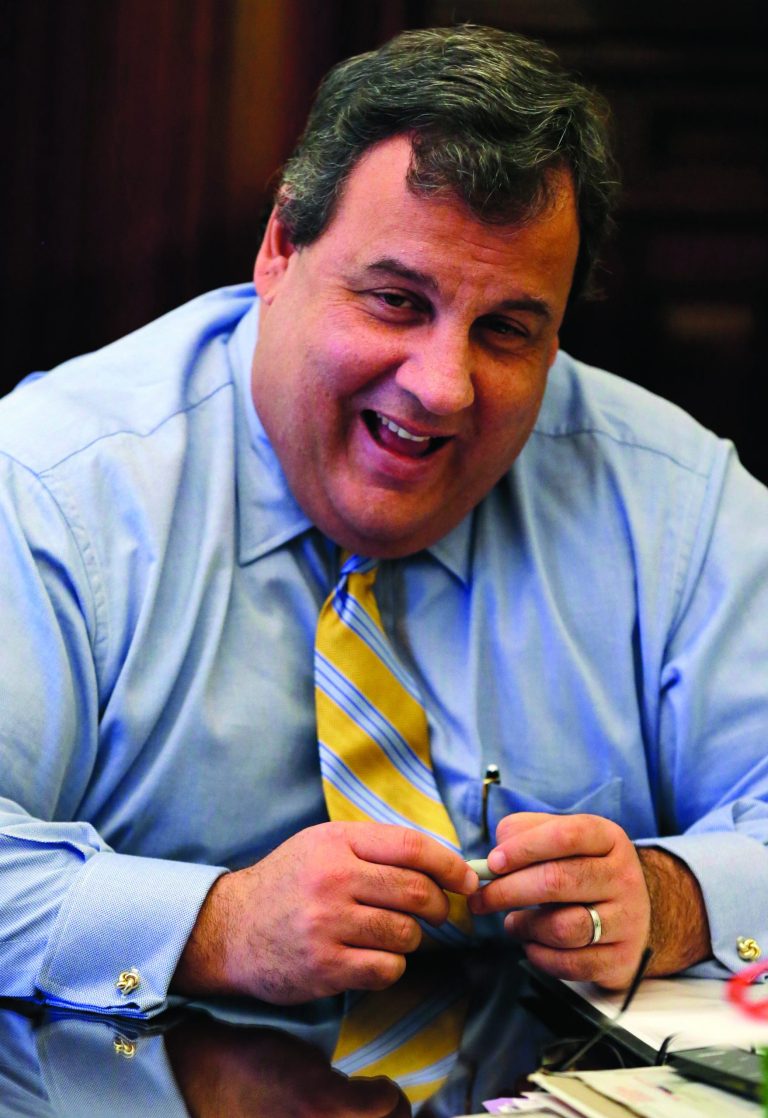 HOLD FOR RELEASE UNTIL 12:01 A.M. EST. THIS STORY MAY NOT BE PUBLISHED, BROADCAST OR POSTED ONLINE BEFORE 12:01 A.M. EST - In this Friday, Jan. 4, 2013 photo, New Jersey Gov. Chris Christie smiles as he listens to a question during an interview in his office at the Statehouse in Trenton, N.J. The first-term Republican has earned nearly universal praise for his handling of Superstorm Sandy, the state's worst natural disaster. But some within his own party called him out for embracing the Democratic president and hurling angry words at a fellow Republican. Christie says the storm and its aftermath should transcend politics. He says he praised the president because Obama was on the front lines helping New Jersey and he called out the speaker after 66 days had elapsed without Congress acting on the aid package. (AP Photo/Mel Evans)