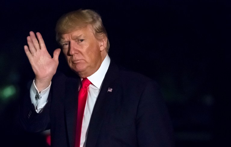 President Donald Trump waves as he w