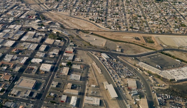 The border wall between Calexico, Calif., and Mexicali, Mexico, has been damaged and breached several hundred times over the past two years. (AP Photo/Gregory Bull)