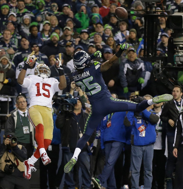 Seattle Seahawks' Richard Sherman tips a pass intended for San Francisco 49ers' Michael Crabtree in the final seconds of the second half of the NFL football NFC Championship game Sunday, Jan. 19, 2014, in Seattle. (AP/Marcio Jose Sanchez, File)