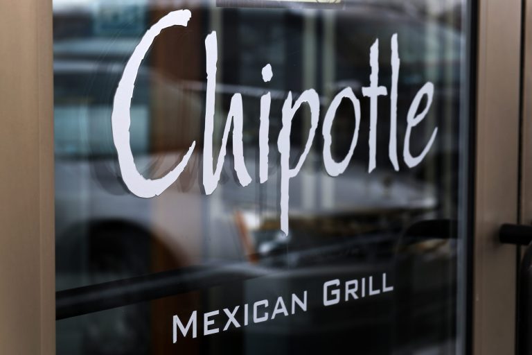 This Tuesday, Jan. 28, 2014, file photo, shows the door at a Chipotle Mexican Grill in Robinson Township, Pa. (AP Photo/Gene J. Puskar, File)