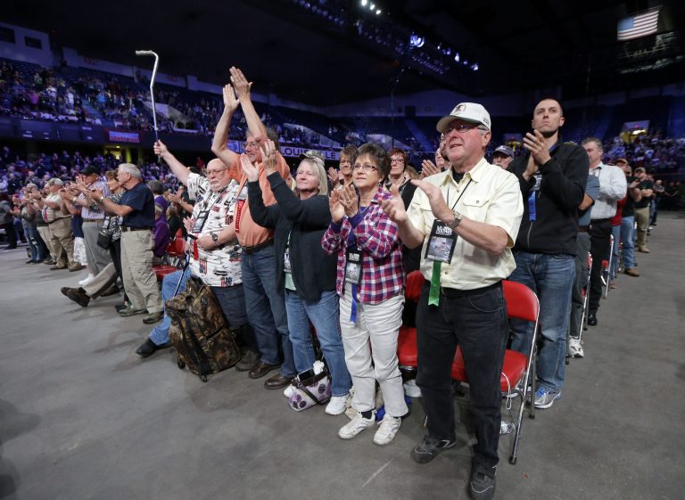 National Rifle Association members cheer during the NRA convention, Friday, May 20, 2016, in Louisville, Ky. (AP Photo/Mark Humphrey)