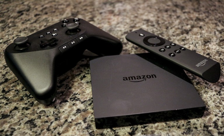 This Monday, Sept. 29, 2014 photo shows the Amazon Fire TV, a product for streaming popular video services, apps and games in high-definition, in Decatur, Ga. Several popular game titles, including 