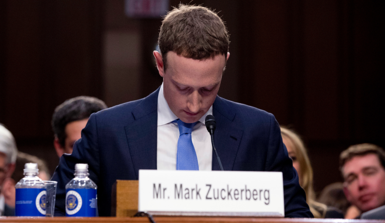 FILE - In this April 10, 2018, file photo Facebook CEO Mark Zuckerberg looks down as a break is called during his testimony before a joint hearing of the Commerce and Judiciary Committees on Capitol Hill in Washington. Twitter's ban on political advertising is ratcheting up the pressure on Facebook and Zuckerberg to follow suit. Zuckerberg doubled down on Facebookâs approach in a call with analysts Wednesday, Oct. 30, 2019, he reiterated Facebookâs stance that âpolitical speech is important." (AP Photo/Andrew Harnik, File)