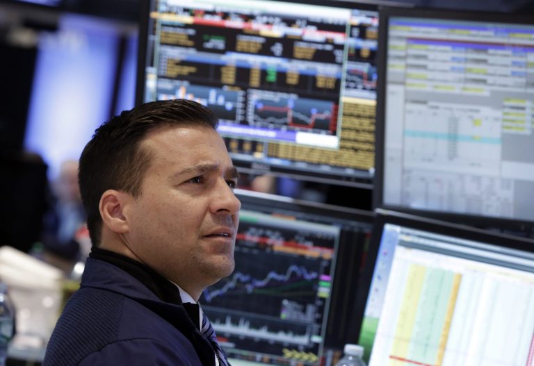 FILE -In this Wednesday, Jan. 29, 2014, file photo, specialist Paul Cosentino works at his post on the floor of the New York Stock Exchange. Shares were lower Thursday Jan. 30, 2014 as weak economic data from China and Japan deepened jitters over ongoing reductions in U.S. monetary stimulus.  (AP Photo/Richard Drew)