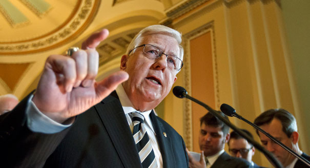 With Cheney as a challenger, Sen. Mike Enzi joins Tea Party effort to defund Obamacare