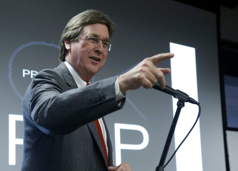 FILE - In this Tuesday, Jan. 29, 2013 file photo, Tulsa Mayor Dewey Bartlett gestures as he speaks during a news conference in Tulsa, Okla. Kathy Taylor is challenging incumbent Bartlett, Jr. in Tulsa's mayor's race, which will be decided Tuesday.(AP Photo/Sue Ogrocki, File)