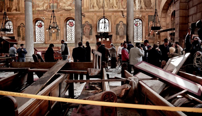 Security forces examine the scene inside the St. Mark Cathedral in central Cairo, following a bombing. (AP Photo/Nariman El-Mofty)