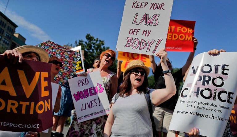 FILE - In this July 10, 2018 file photo, women demonstrate during a pro-choice rally in New York. On Wednesday, Nov. 28, 2018, representatives of several national anti-abortion groups met with administration staffers at the White House to discuss how President Donald Trump _ who has supported their agenda _ could continue to be helpful in the changed political circumstances.