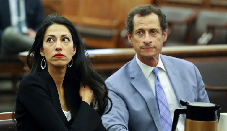 Anthony Weiner, right, and Huma Abedin are seen in court. Weiner is expected to be sentenced Monday for sending sexually suggestive texts to a minor. (Jefferson Siegel/The Daily News via AP, Pool)