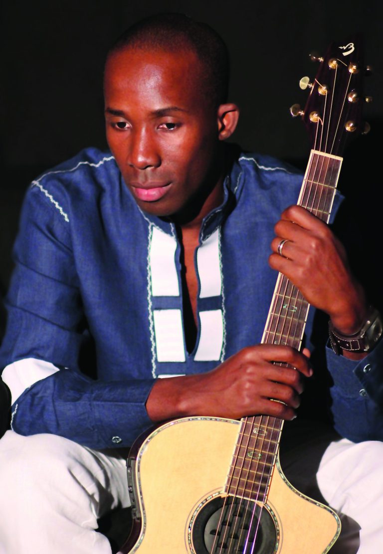 Haitian guitarist BélO plays for the cause at Millennium Stage
